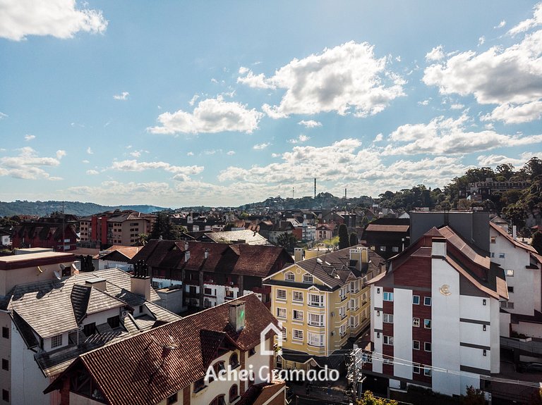 Apto bem no Centro 2 dorm by Achei Gramado