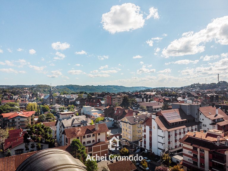 Apto bem no Centro 2 dorm by Achei Gramado
